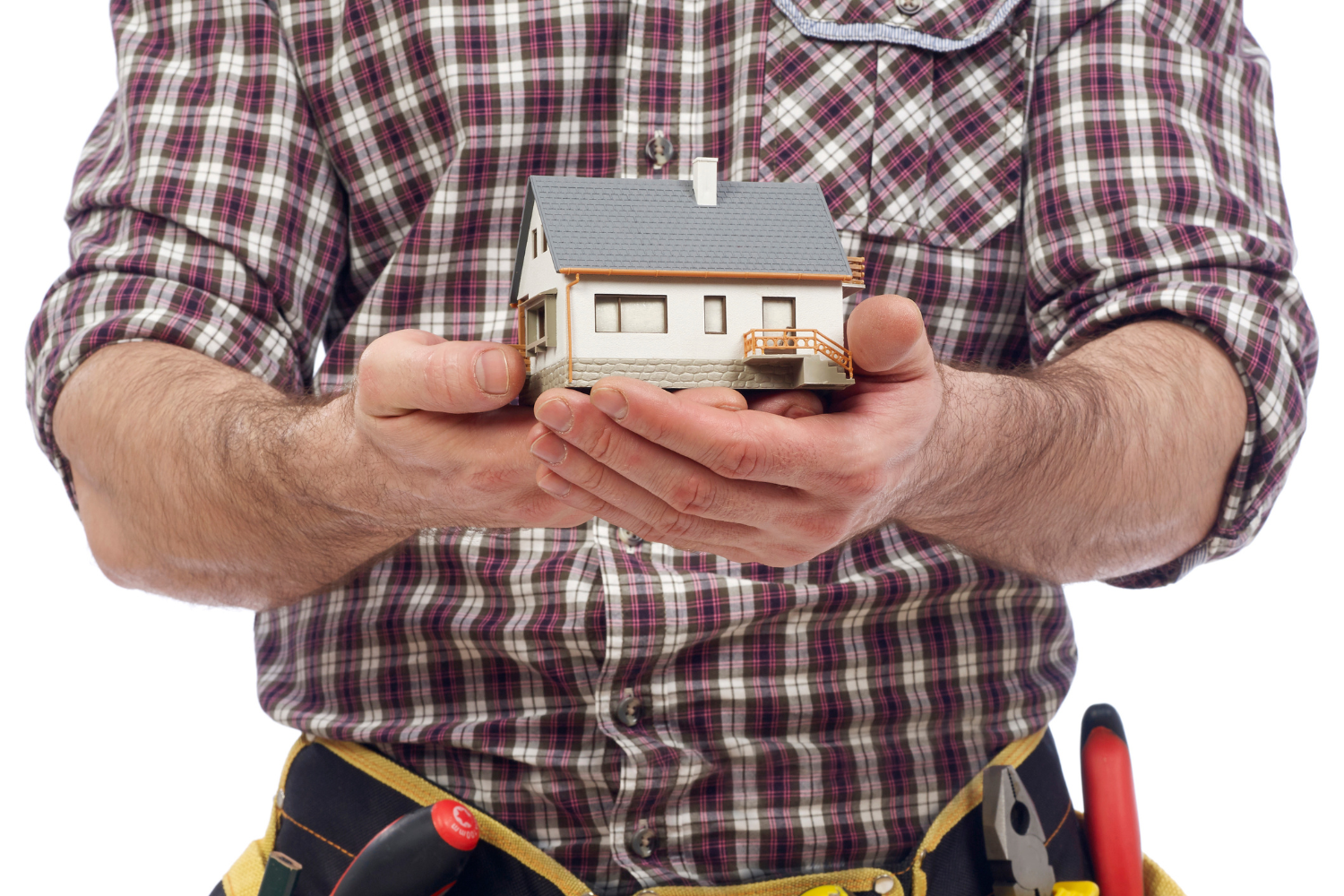Home appliance technician holding a house in his hands, quality care. / Técnico de electrodomésticos con una casa en sus manos, atención de calidad.